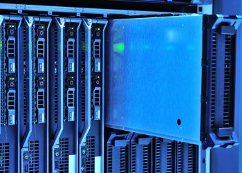 Detailed view of server racks with glowing lights in a data center environment.
