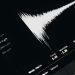 Close-up of a digital audio editing interface displaying sound waves and file names.