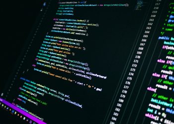 Close-up of colorful programming code on a computer screen, showcasing digital technology.