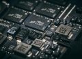 Detailed close-up of electronic microchips on a circuit board, showcasing technology and engineering intricacies.