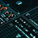 Close-up of a digital interface showcasing futuristic graphs and data analytics in low light.
