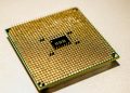 Detailed close-up of a golden microprocessor chip, ideal for technology concepts.