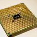 Detailed close-up of a golden microprocessor chip, ideal for technology concepts.