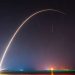 A breathtaking shot of a rocket launch, creating a vivid trail under a starry night sky.