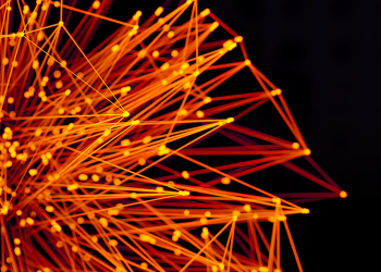 Vibrant orange lines and dots form an abstract network on a dark background, evoking technology and connectivity.