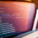 Focused view of a computer screen displaying code and debug information.