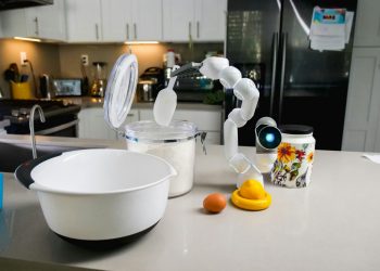 AI-powered robot assisting in a kitchen, highlighting smart technology in everyday cooking.
