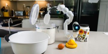 AI-powered robot assisting in a kitchen, highlighting smart technology in everyday cooking.
