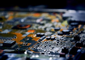 Detailed close-up view of electronic circuit board, showcasing modern technology.