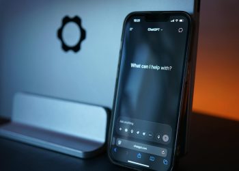 Close-up of a smartphone with AI chat interface, showcasing advanced technology in a sleek design.
