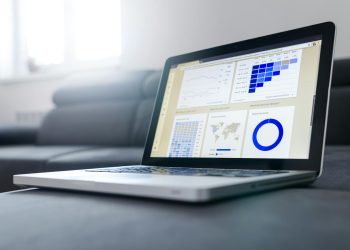 Sleek laptop showcasing data analytics and graphs on the screen in a bright room