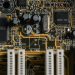 Detailed view of a motherboard with visible microchips and circuits.