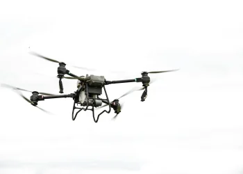 A drone flying in the sky, showcasing modern aerial technology and innovation.
