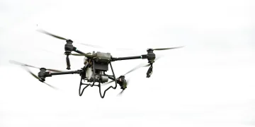 A drone flying in the sky, showcasing modern aerial technology and innovation.