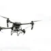 A drone flying in the sky, showcasing modern aerial technology and innovation.