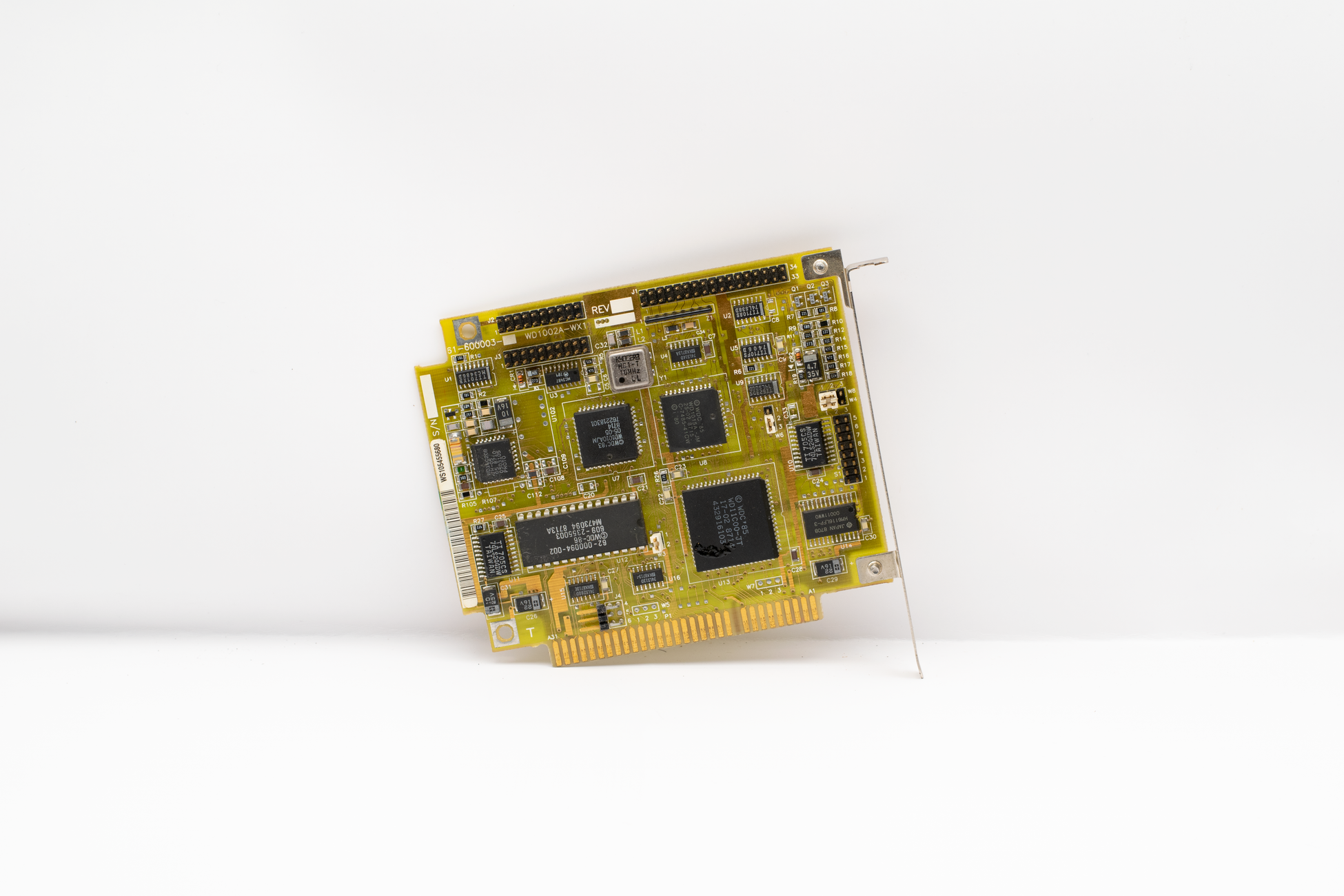 Antique circuit board showcasing vintage computing technology, isolated on a white background.