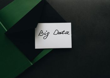 A minimalist photo of a card with 'Big Data' text inside a green envelope, showcasing modern concepts.