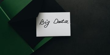A minimalist photo of a card with 'Big Data' text inside a green envelope, showcasing modern concepts.