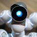 Detailed close-up shot of a futuristic toy robot with a glowing head, focused on innovation.