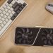 Top view of a desktop with a keyboard, mouse, and graphics card.