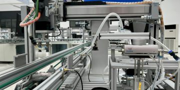 Close-up view of modern automation machinery in an industrial setting.