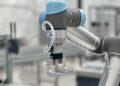 Close-up of a robotic arm in a modern industrial environment, highlighting technology.
