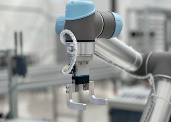 Close-up of a robotic arm in a modern industrial environment, highlighting technology.