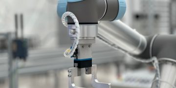 Close-up of a robotic arm in a modern industrial environment, highlighting technology.