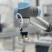 Close-up of a robotic arm in a modern industrial environment, highlighting technology.