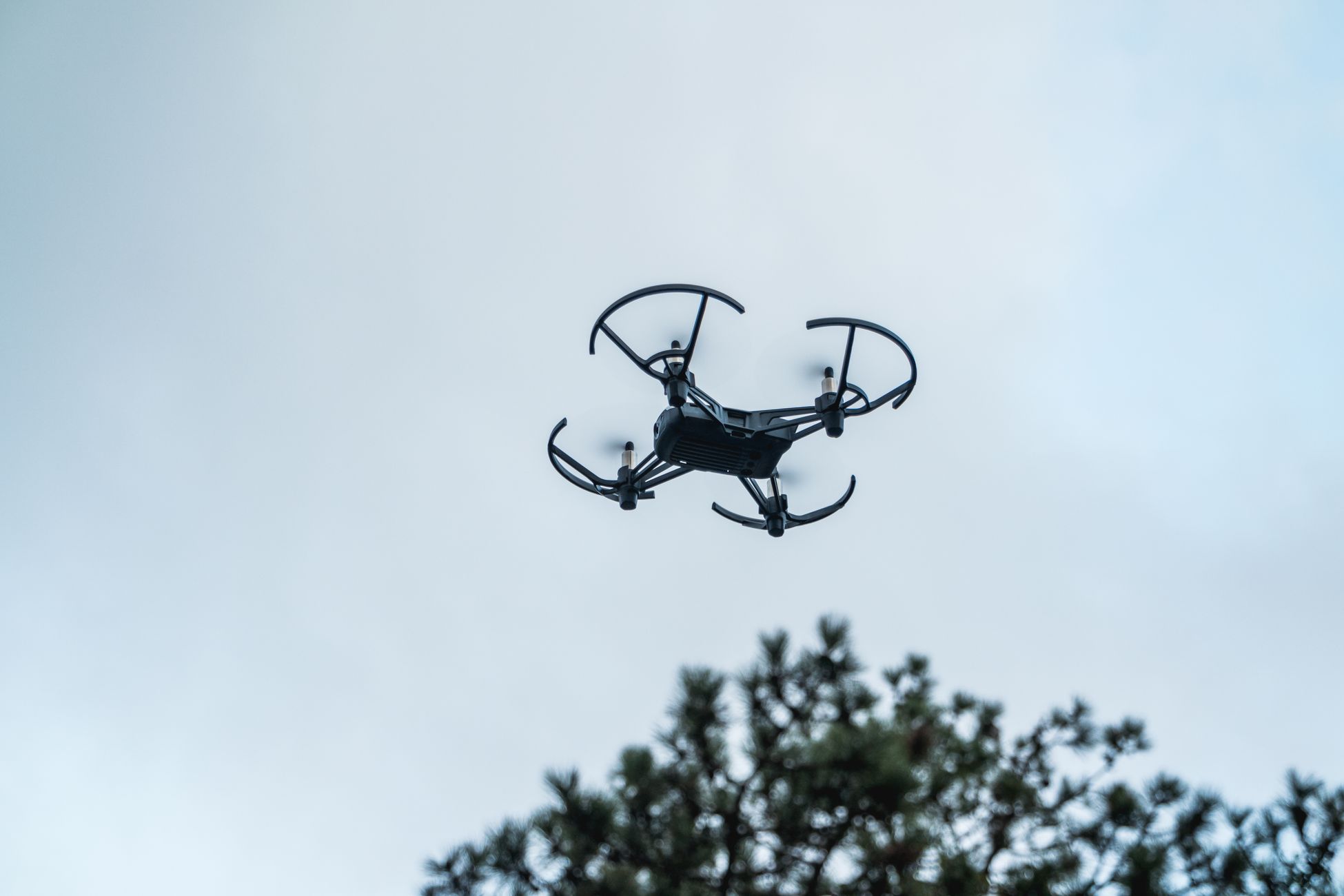 A drone captured in mid-flight against a clear sky in Istanbul, Turkey.