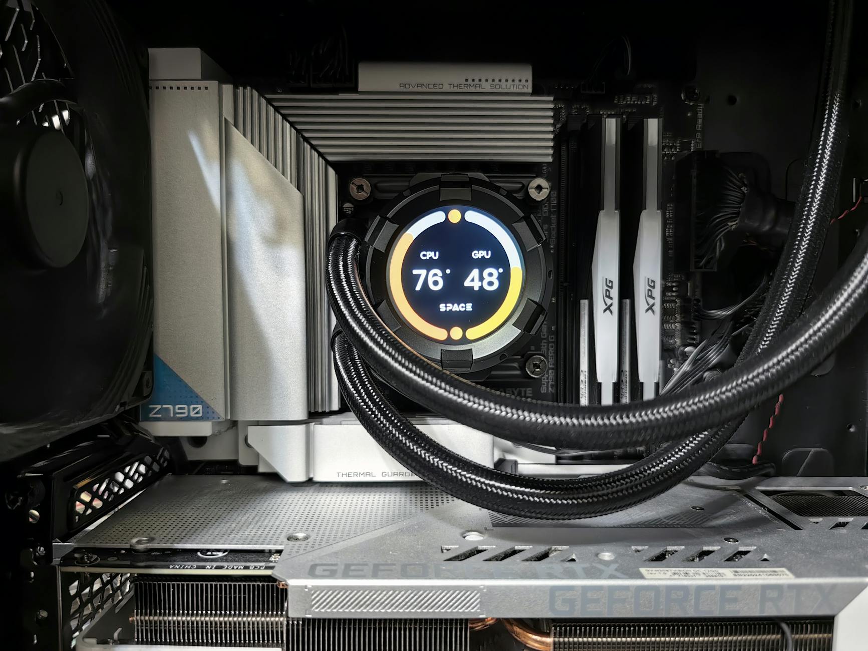 Close-up view of advanced PC hardware with visible GPU and cooling system in detail.