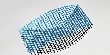 Dynamic abstract grid with blue and black colors on a white background.