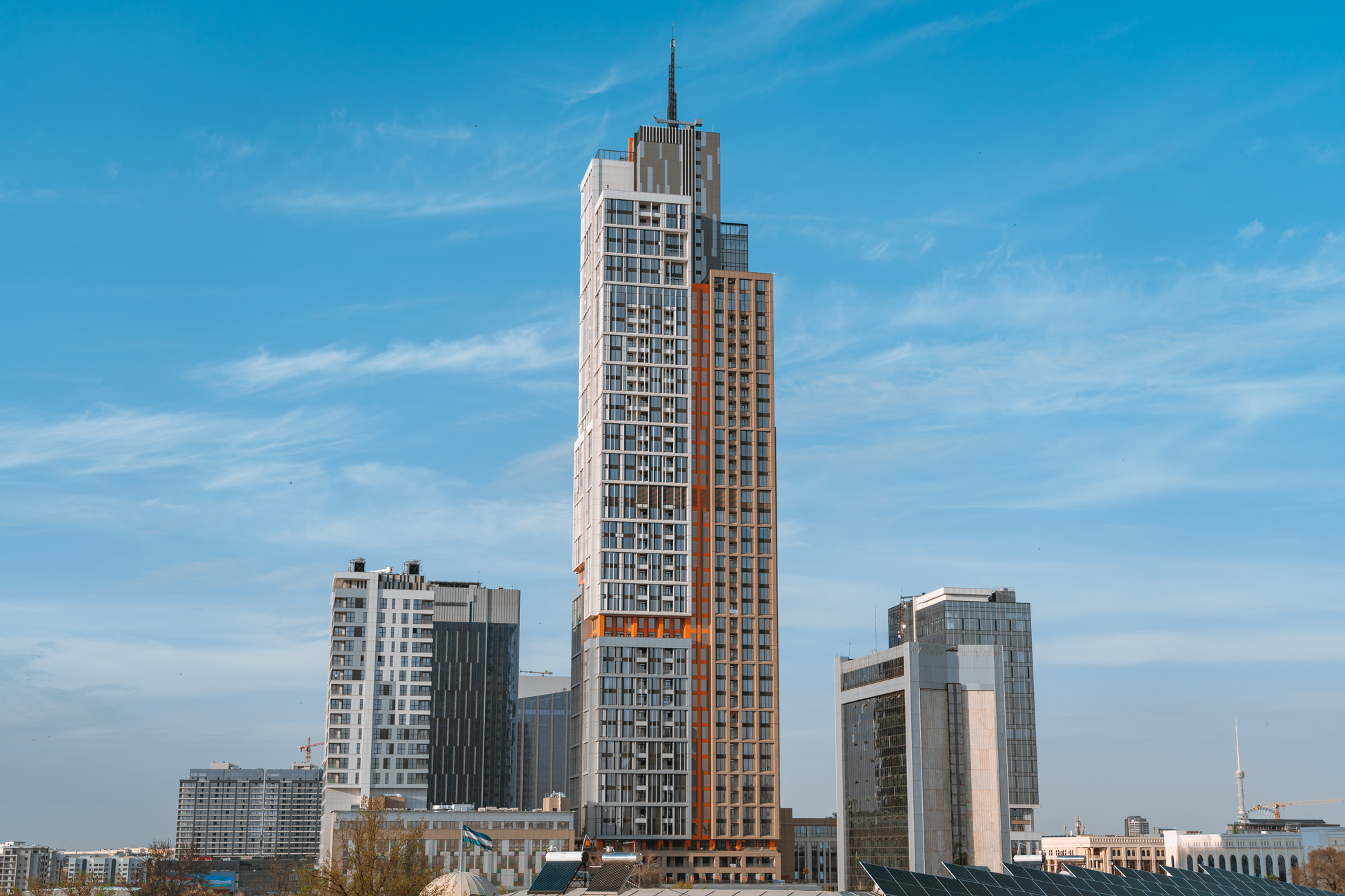 A stunning view of Tashkent's modern skyscrapers under a clear blue sky.