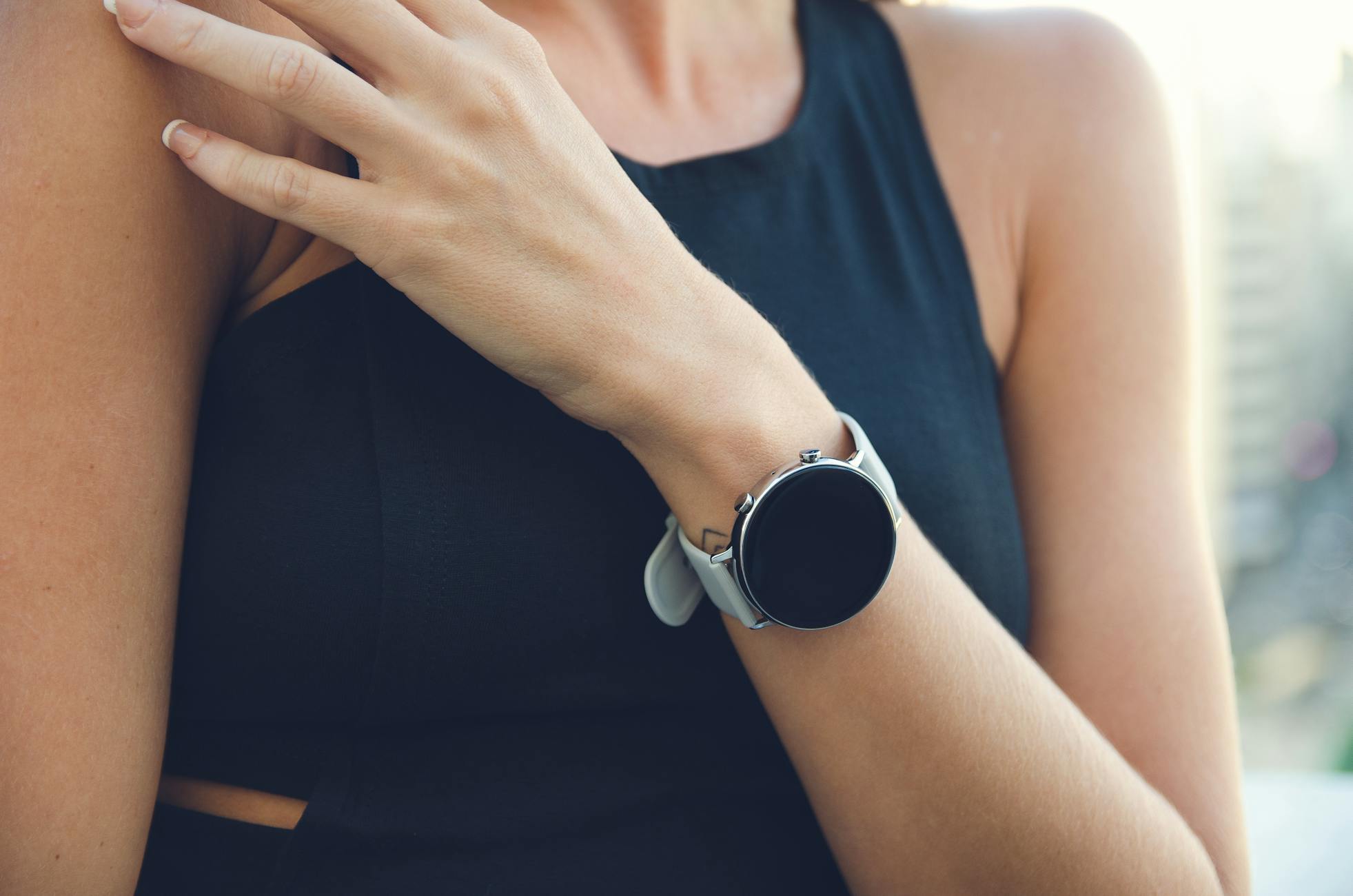 Close-up of a woman wearing a sleek smartwatch, ideal for tech-lifestyle imagery.