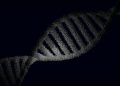Artistic rendering of a DNA strand with particle effects against a dark background.