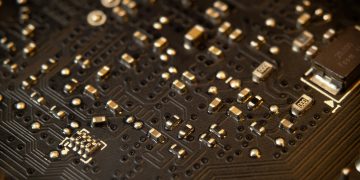 Detailed view of a circuit board showing various electronic components and traces.