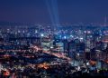 A breathtaking aerial view of a vibrant city illuminated at night.