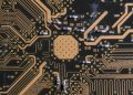 Detailed image of a printed circuit board highlighting electronic pathways and components.