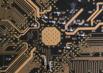 Detailed image of a printed circuit board highlighting electronic pathways and components.