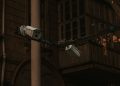 Street security cameras mounted on a pole in an urban environment, highlighting surveillance.