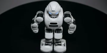 A detailed view of a white robot toy standing on a black surface, showcasing modern toy technology.