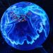 A vibrant illuminated globe display showcasing technological advancements at a science museum.