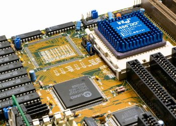 Detailed view of an Intel i486 DX2 CPU installed on a vintage motherboard with chips and circuits.