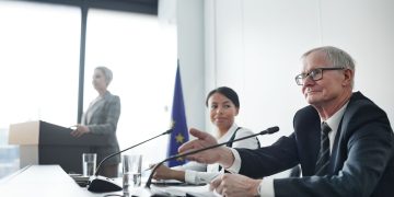 Panelists at an EU conference discussing law and diplomacy.