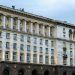 Illuminated government building in Sofia, showing classic architectural design under a twilight sky.