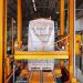 An industrial machine in a glass factory showcasing automated packaging in Dar es Salaam.