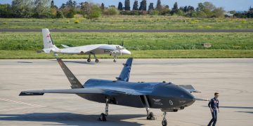 Advanced military drones on a tarmac in Istanbul, Turkey, showcasing modern aerial technology.