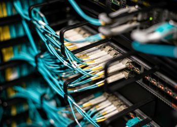 Numerous wires and cables mounted into server patch panel in modern data center