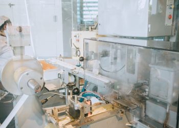 Close-up of advanced machinery in a modern laboratory setting, highlighting technology and industry.