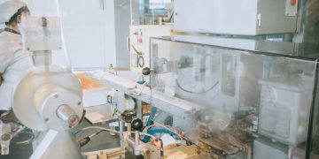 Close-up of advanced machinery in a modern laboratory setting, highlighting technology and industry.